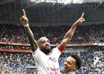 50 Kayne BONNEVIE (ol) - 10 Alexandre LACAZETTE (ol) during the Ligue 1 Uber Eats match between Lyon and Montpellier at Groupama Stadium on May 7, 2023 in Lyon, France. (Photo by Christophe Saidi/FEP/Icon Sport)